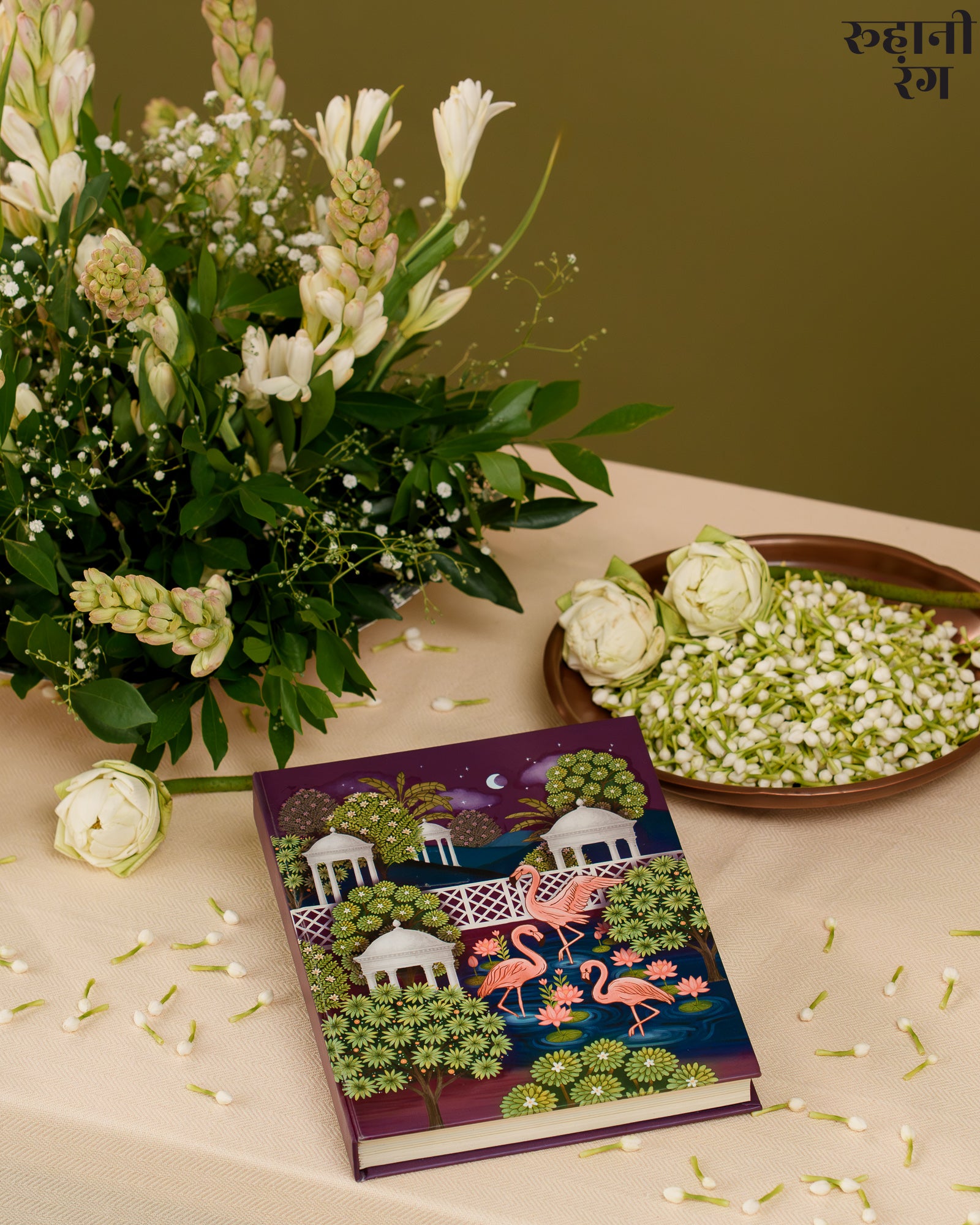 Decorative planner 2026 with flamingo design on a table with flowers and greenery