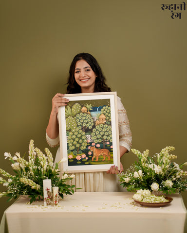 Woman holding a framed artwork with a green background