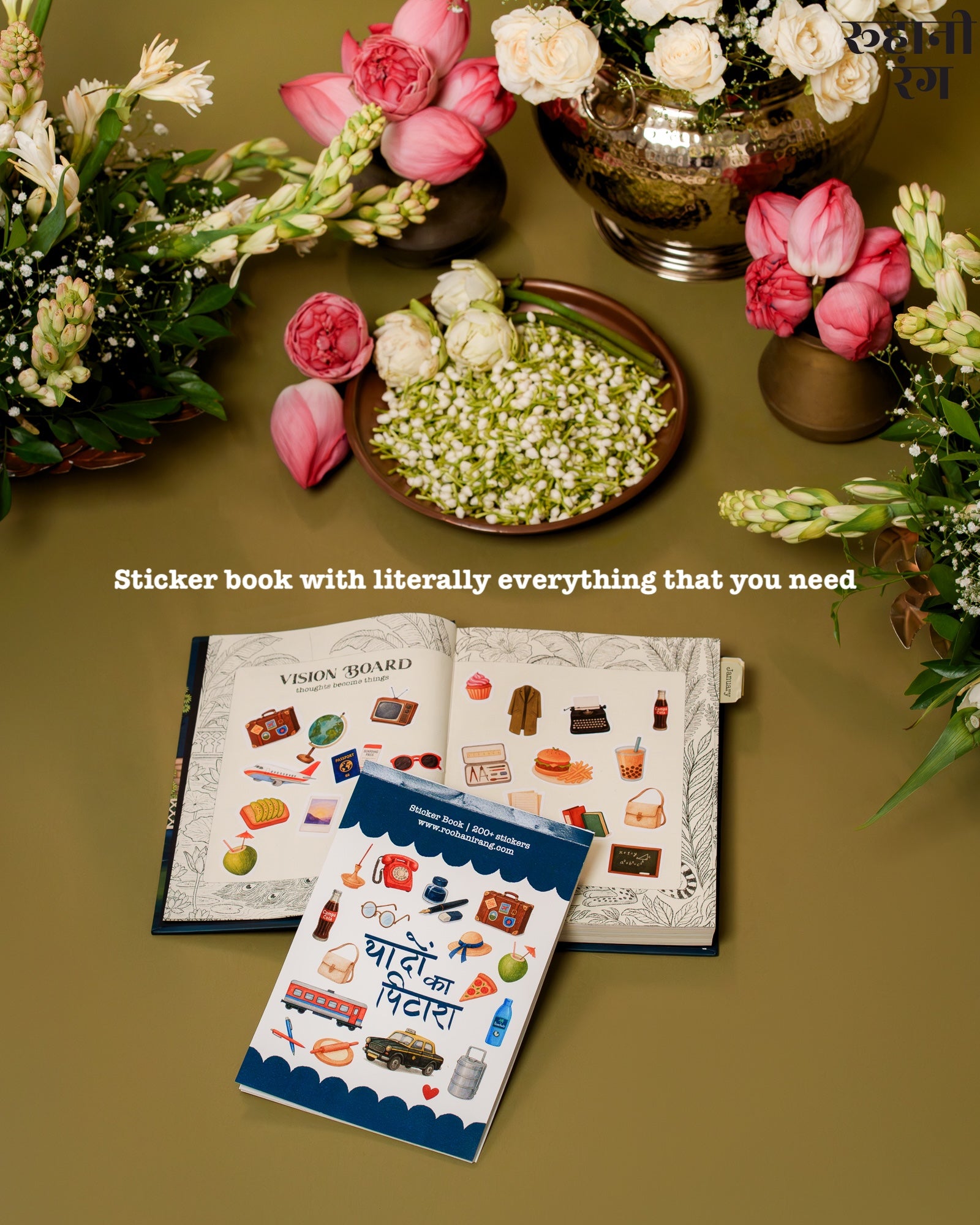Sticker book with various stickers on a table with floral arrangements