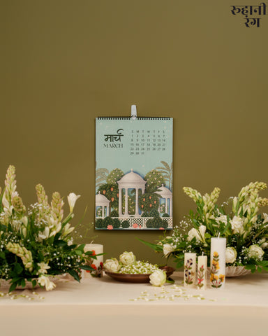 Miniature painting-inspired calendar page with white domes and temple gardens, celebrating Indian architecture and tranquility.